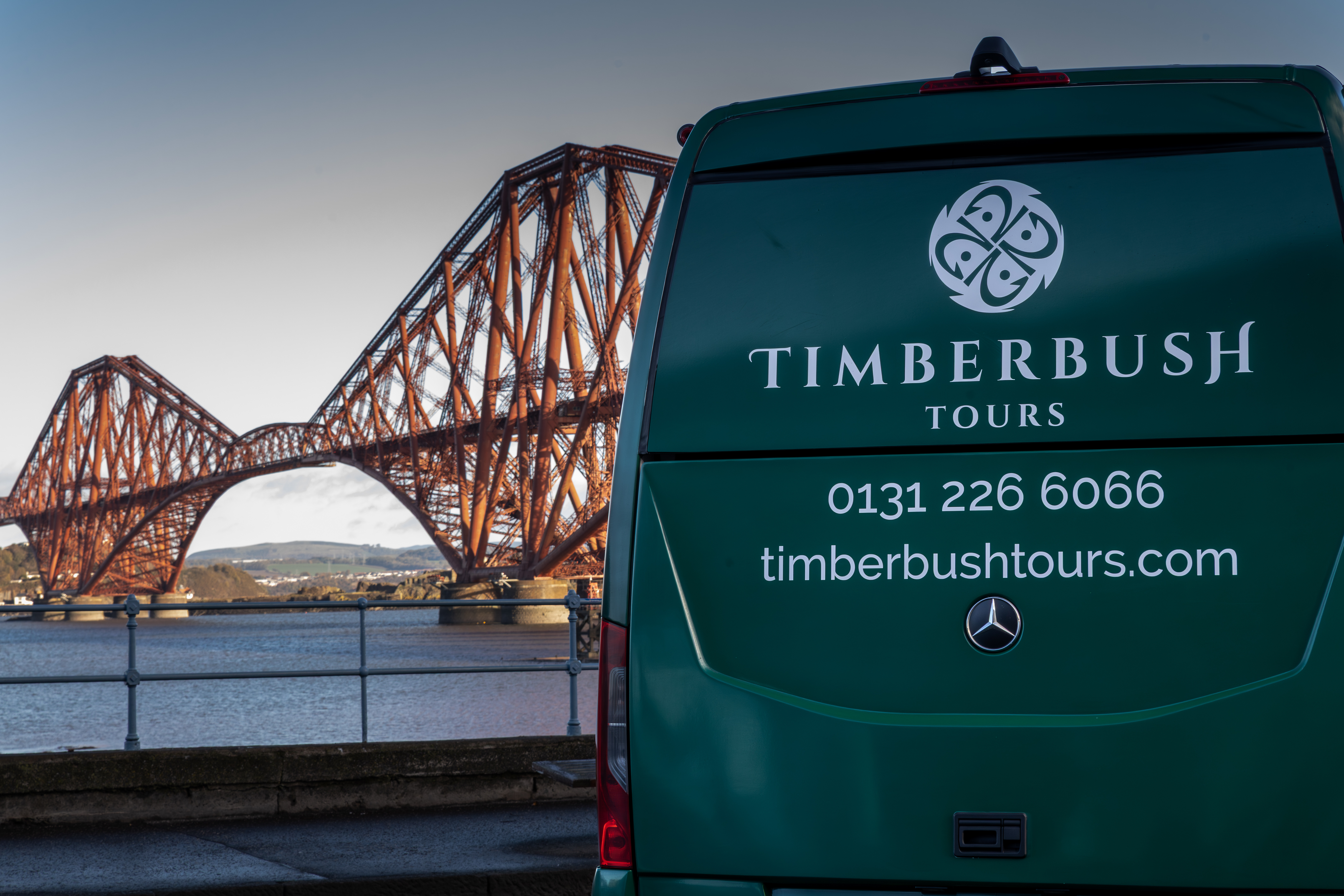 A bus with the Forth Bridge in the background